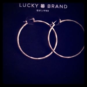 Gold hoop earrings by lucky